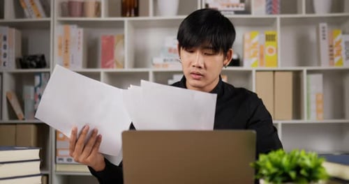 Businessman checking corporate paperwork