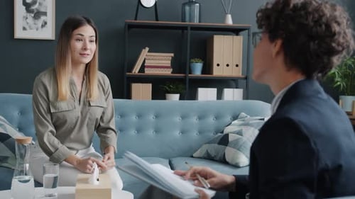 Woman Talks with Therapist in Counseling Session