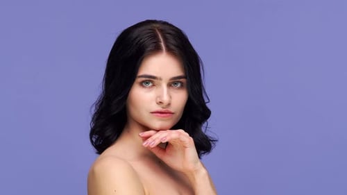 Studio portrait of young and beautiful brunette woman.