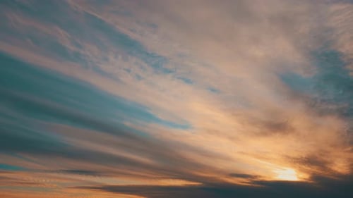 Beautiful Clouds Lit by Golden Sunset Time Lapse
