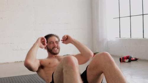 Man Doing Crunches for Core Strength at Home