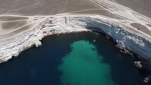 Unmanned Aerial Photography of a Steep Rocky Coastline on a Sunny Summer Day