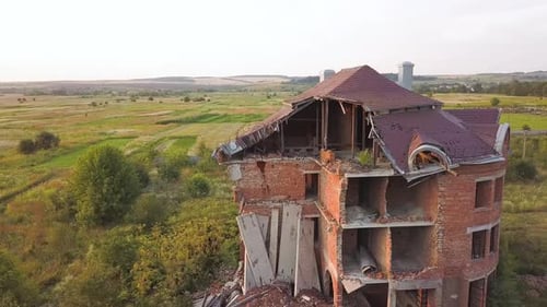 Aerial view of an old ruined building after earthquake. A collapsed brick house.