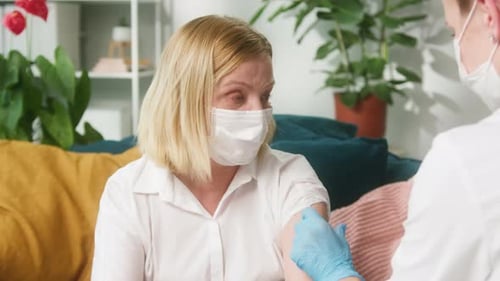 Woman Receives Vaccination at Home From Health Professional