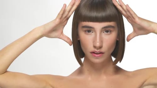 Beautiful Woman with Bob Hairstyle Posing in Studio