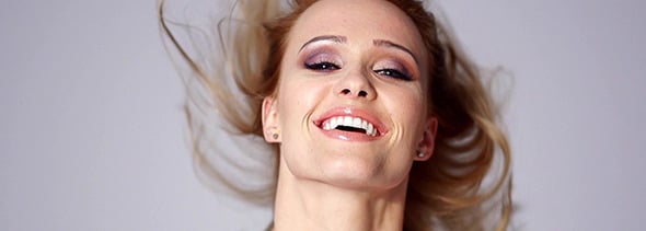 Beautiful Blond Woman Throwing Hair in Slow Motion