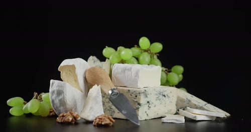 Display of Cheeses, Grapes, and Walnuts