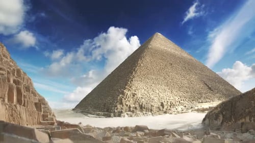 Ancient Pyramid in Desert Landscape with Moving Clouds