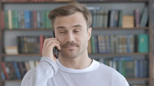 Man Talking on Phone Close Up Indoors