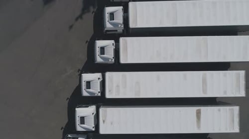 Large Truck Parking Near the Highway, View From Height, a Large Number of White Trucks in the