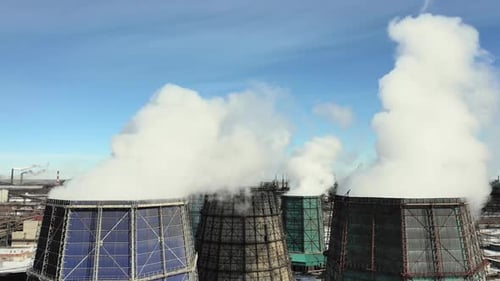 Aerial Drone View of Smoking Pipes and Cooling Towers of Coal Thermal Power Plant. Thermal Power