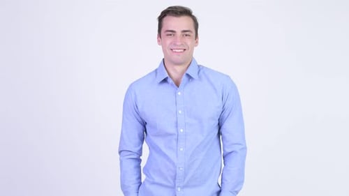 Young Adult Smiling Wearing a Collared Shirt