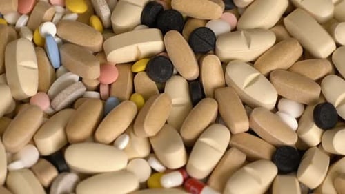 Pile of Pills and Capsules close up