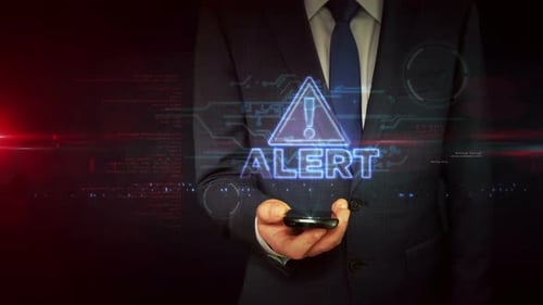 Símbolo de alerta en la mano del empresario