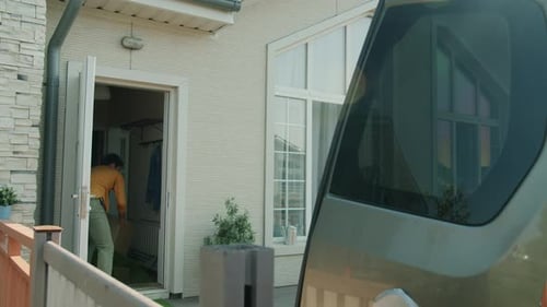 Home Delivery Made by Two Men Outdoors