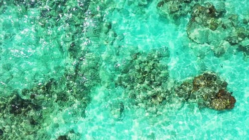 Wide overhead travel shot of a summer white paradise sand beach and turquoise sea background in vibr