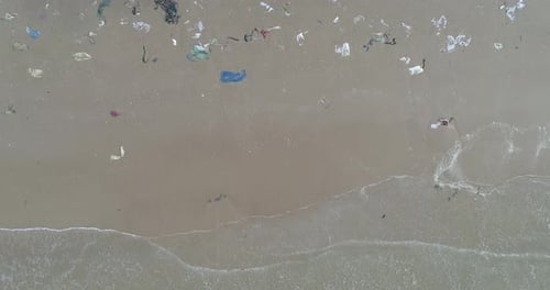 Trash, plastic, garbage, bottle... environmental pollution on the beach