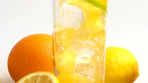 Refreshing Citrus Beverage Being Prepared with Fresh Fruit