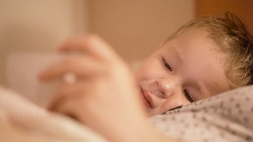 Child Resting in Bed in Close Up Shot