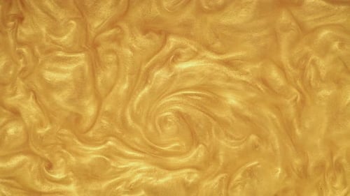Flowing Shine. Gold Paint Texture Abstract Background