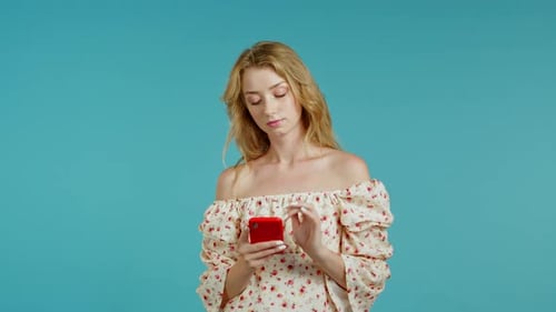 Woman Reacting Happily to her Smartphone News