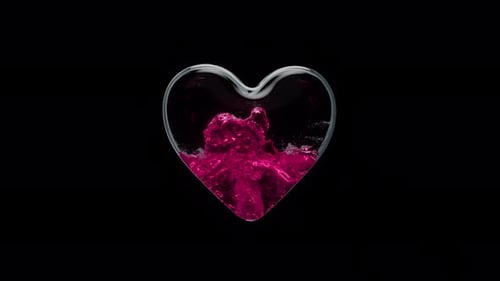 a Glass Container in the Form of a Heart is Filled with Liquid with an Alpha Channel