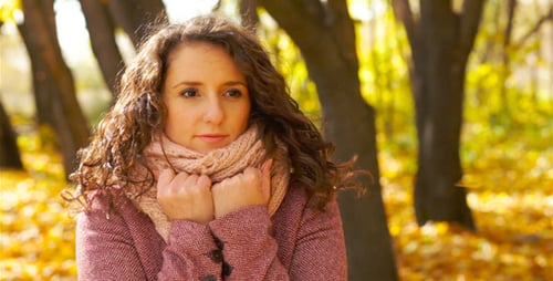 Woman in Scarf and Coat Outdoors in Autumn Park