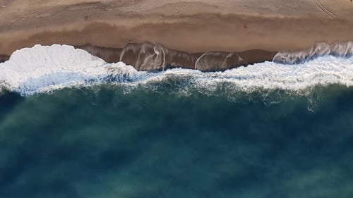 Relaxing View of Ocean Waves on Sandy Beach