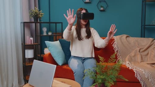 Female Enjoys Virtual Reality Experience at Home