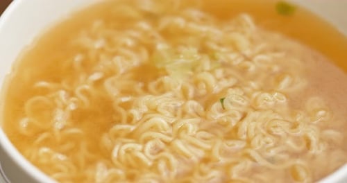 Delicious Bowl of Noodles in Golden Broth