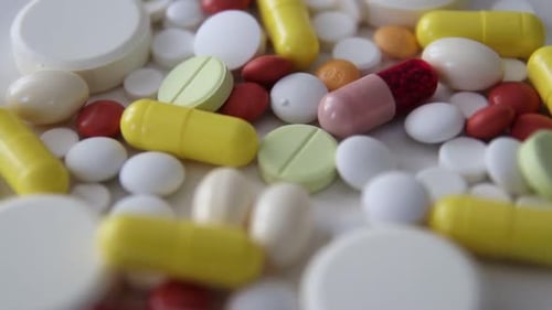Pile of Colorful Pills and Capsules Close Up