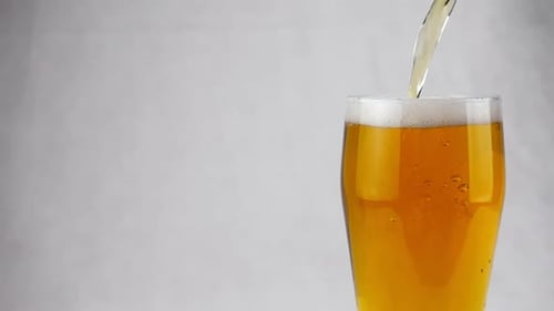Beer Pouring into a Glass Close Up