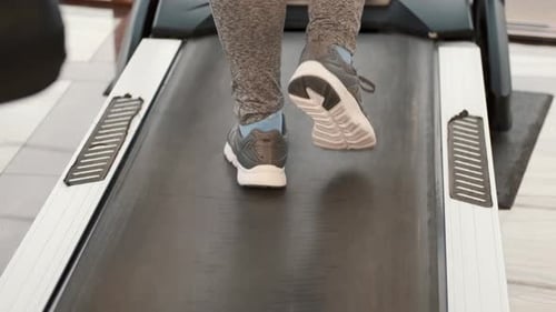 Unrecognizable Overweight Woman In Gym Walking On Treadmill