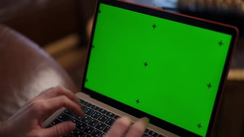 Hands Typing on Laptop with Green Screen