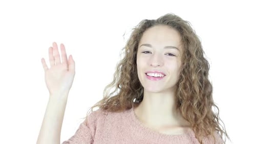 Smiling Woman Waving Hand in Greeting