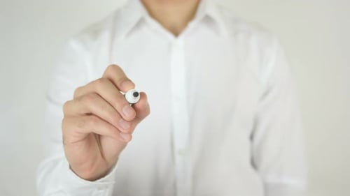 Man Writes the Word Crisis on Transparent Surface