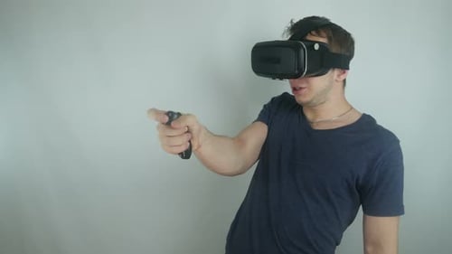 Man Uses VR Headset and Controller