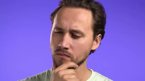 Pensive Man Thinking and Touching Chin