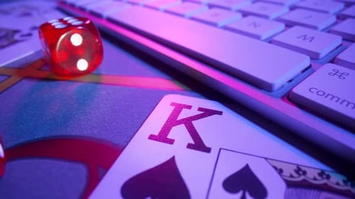 Gaming Table with Computer Keyboard Cards Dice and Casino Chips