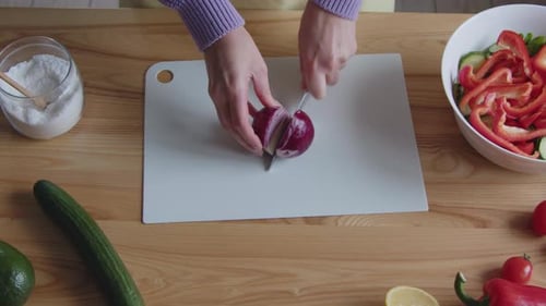 Preparing Salad With Red Onion and Vegetables