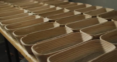 Animation of rows with bred molds preparing for use in bakery
