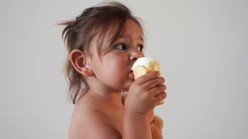 Cute Child Eating Ice Cream Delightfully