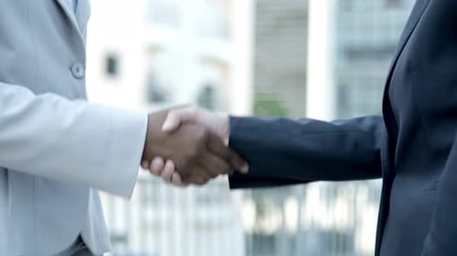 Professional Handshake in a Modern Urban Setting