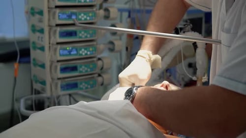 Anesthesist Performs an Intubation of the Patient Before the Operation