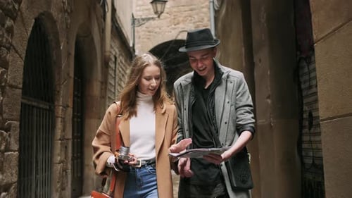 Couple Exploring Old City With Map and Camera