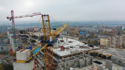 Construction of a residential apartment complex. Multi-storey building under construction.