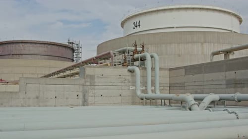 Large crude oil storage tanks in a huge refinery