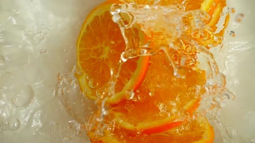 Oranges Falling Into the Water