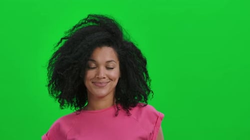 Smiling Woman with Curly Hair on Green Screen