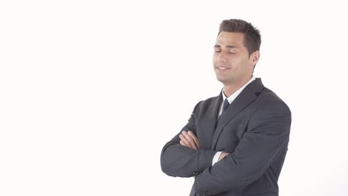 Confident Businessman Smiles with Arms Crossed